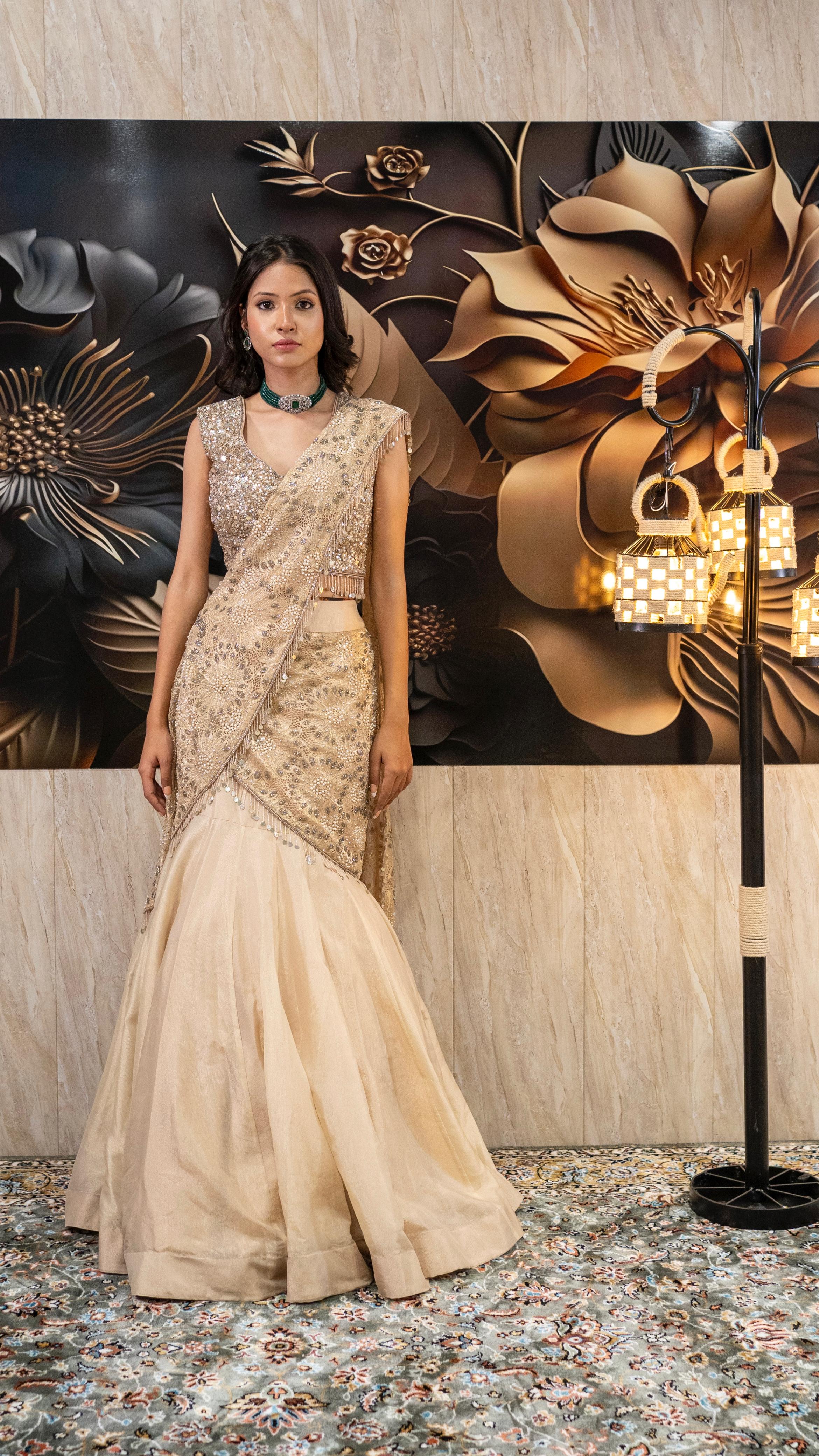 Champagne Gold Sequin Embroidered Peplum Blouse & Flared Skirt Set   URVASHI BY PARIDHI GUPTA